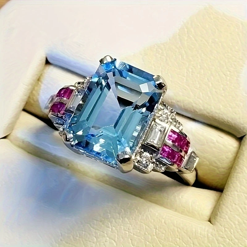 Bague lumineuse en cristal bleu et grenat