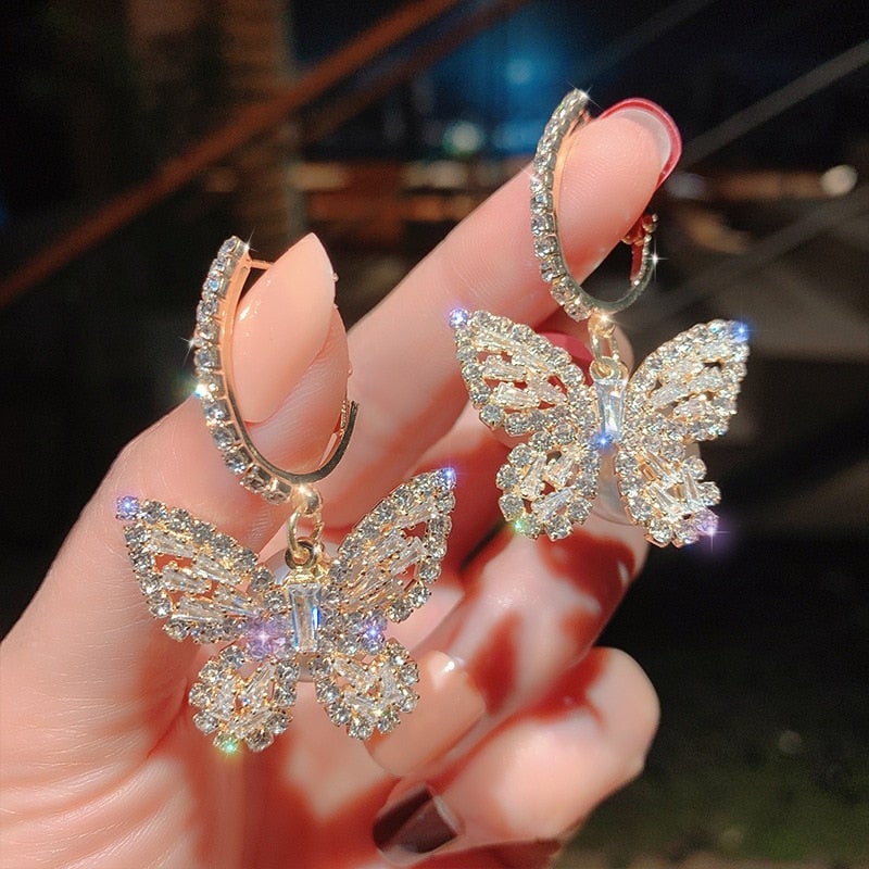 Boucles d'oreilles papillon avec zirconium en or