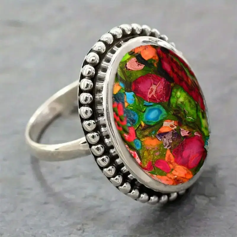 Bague en pierre colorée argentée