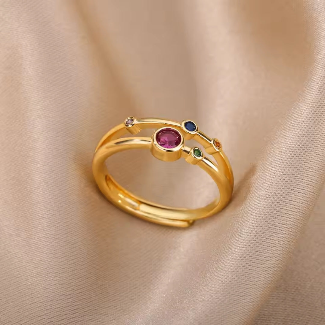 Bague en or façonnée avec des pierres colorées
