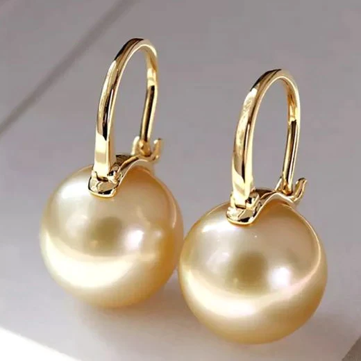 boucles d'oreilles élégantes en perles dorées