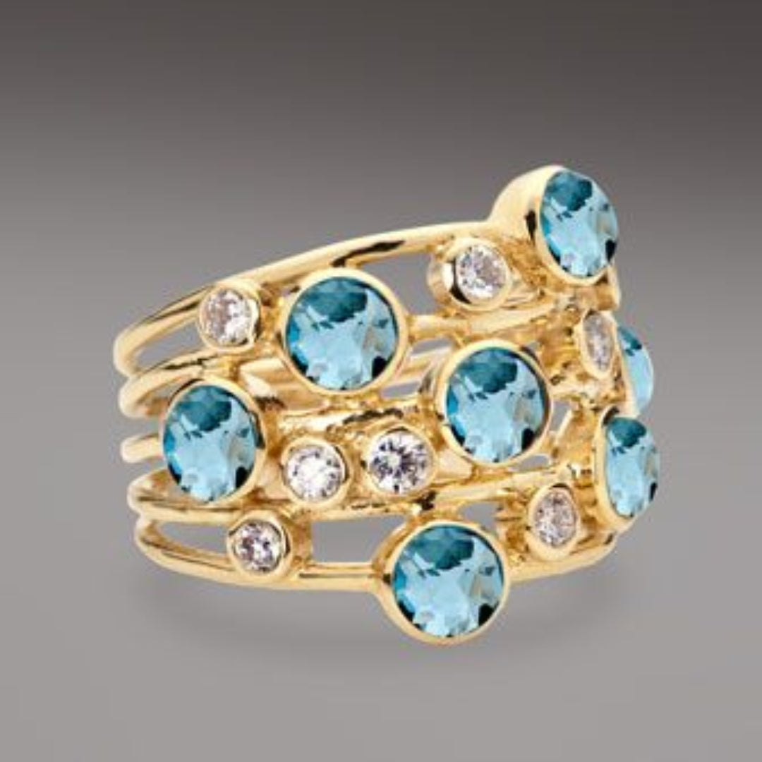 Bague dorée ancienne avec zirconium incrusté bleu