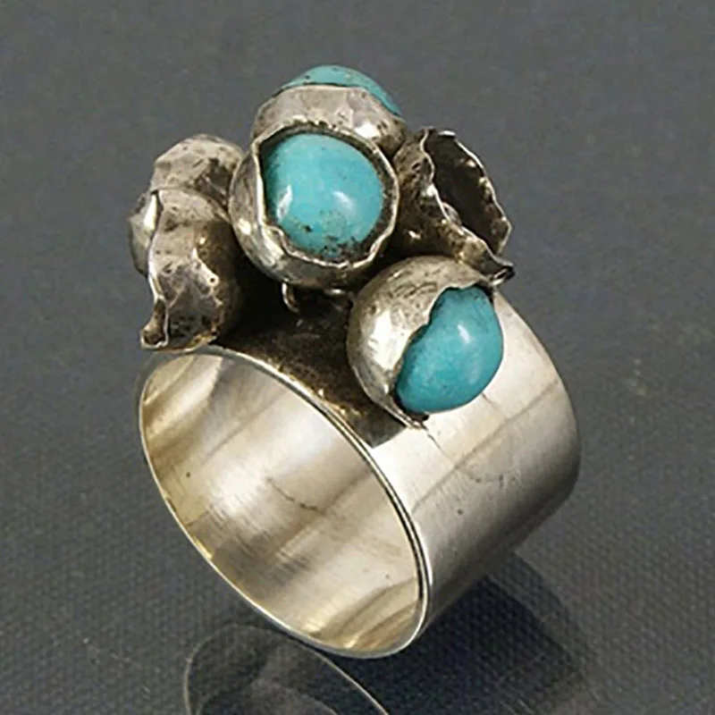 Bague en argent ancienne avec pierres bleues incrustées