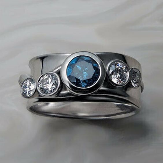 Bague en argent avec verre rond en pâte de verre bleu vintage incrusté