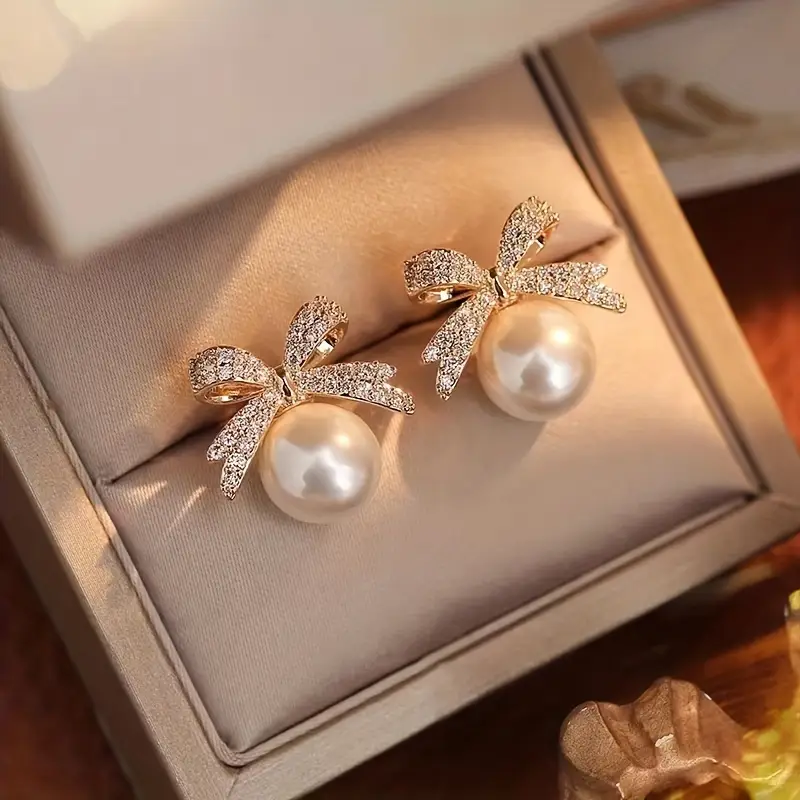 Boucles d'oreilles en perles et nœud brillant