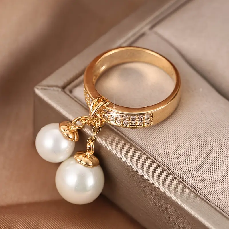 Boucles d'oreilles pendantes avec perle brillante