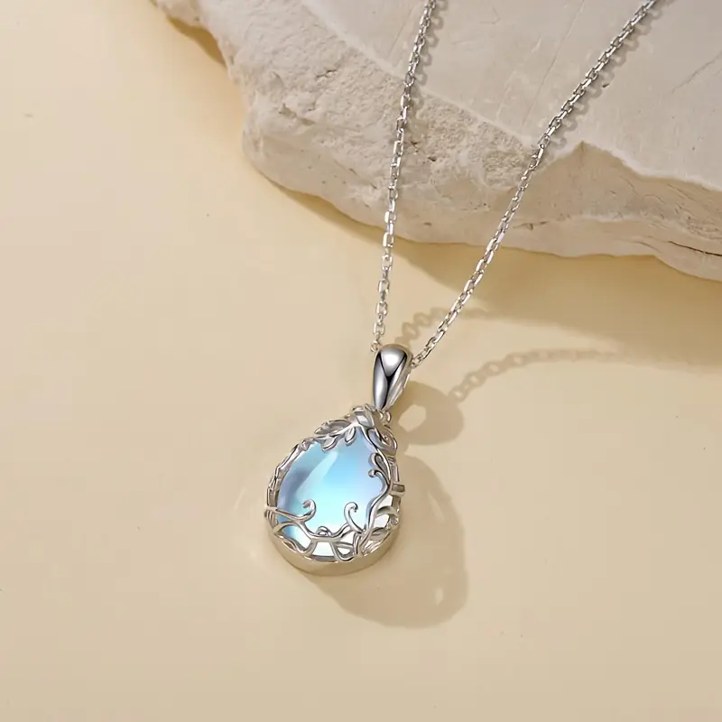 Collier vintage en cristal blanc et bleu avec pendentif