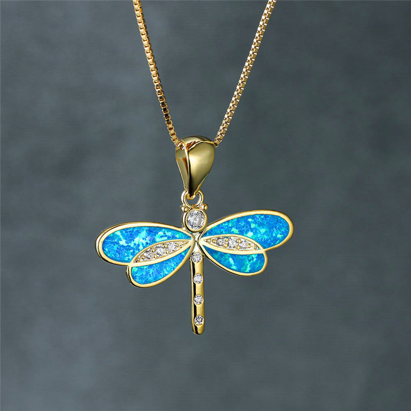 Collier libellule en or avec accent en opale