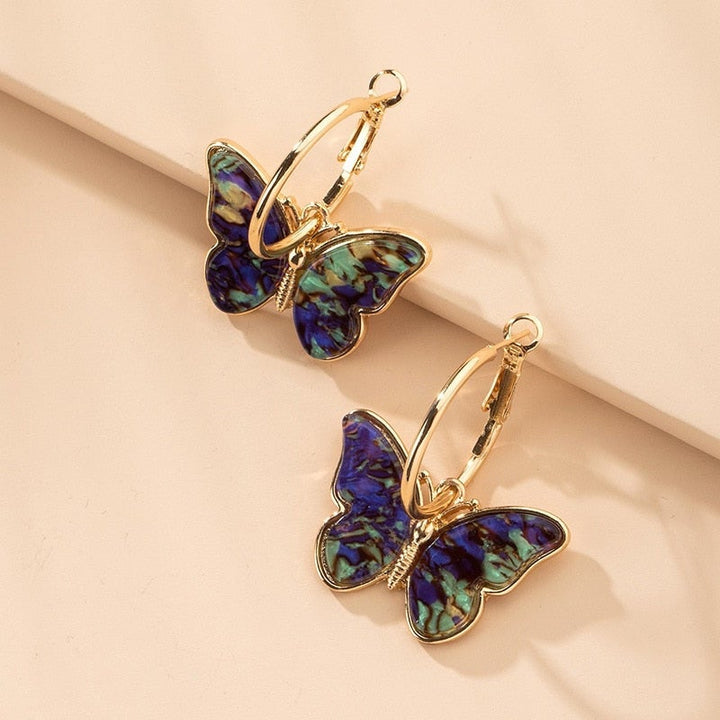 Boucles d'oreilles en cristal et émail peint à la main avec papillon