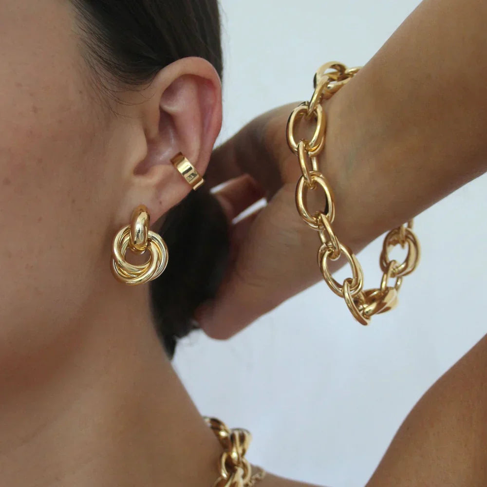 Boucles d'oreilles interconnectées en or